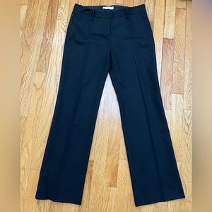 AUTHENTIC Black Prada Trousers with pockets in the front.